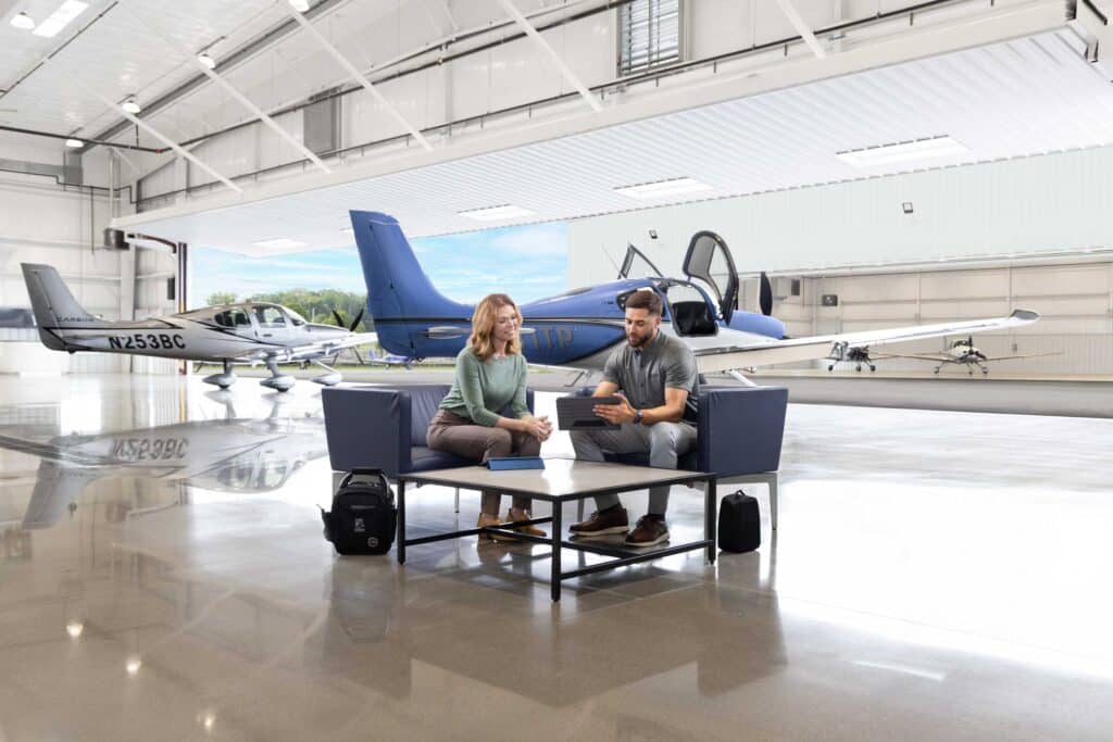 Student with instructor in front of SR Series aircraft
