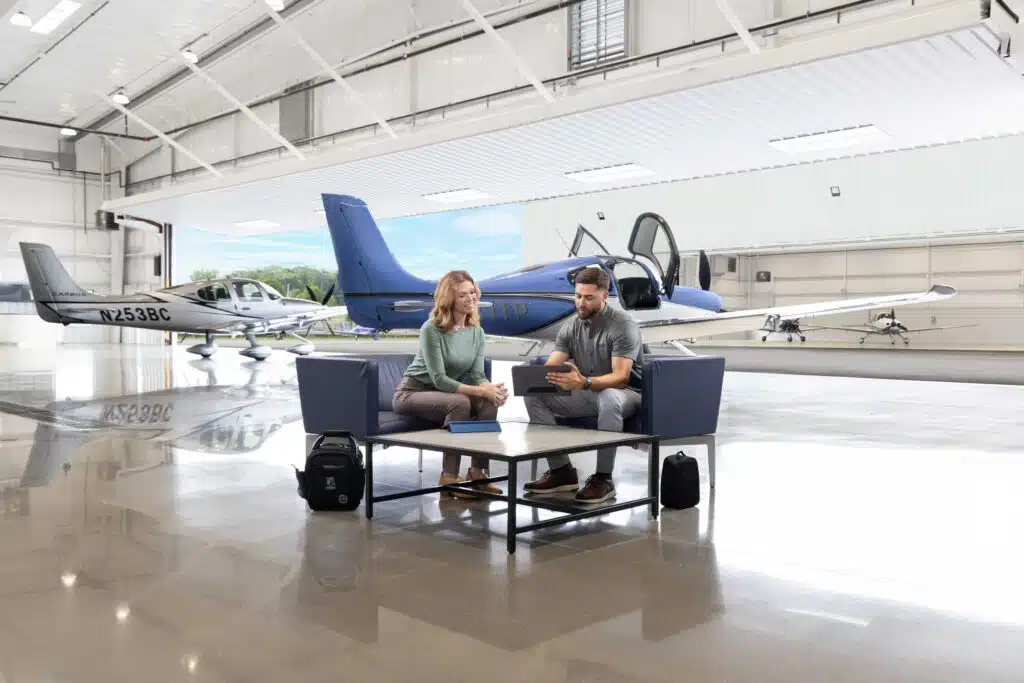 Student with instructor in front of SR Series aircraft
